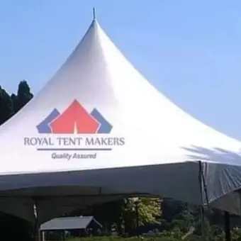 Royal Tent Makers pyramid tent with dining tables set up for a function