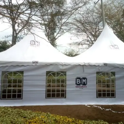 Twin-peak tent printed with client security company branding