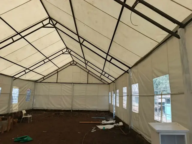 Interior frame of an event tent being assembled on site